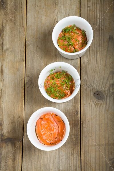 Three cups with marinated salmon – Stock photos from around the world